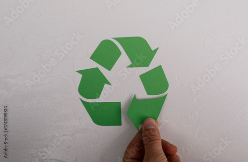 A hand carefully places a g...