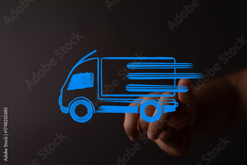 Hand pointing at a blue del...