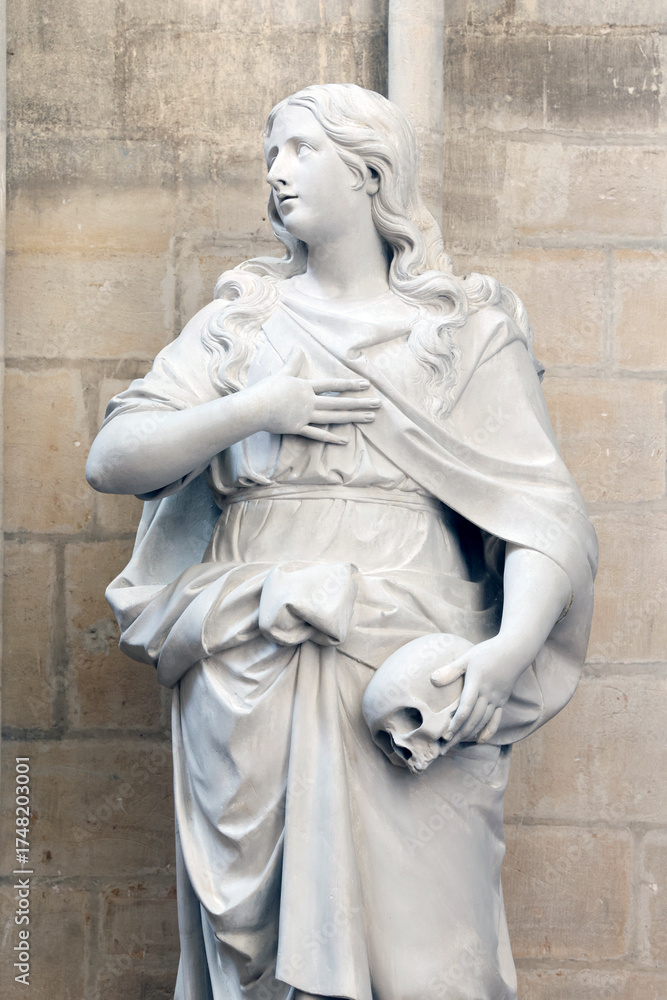 Obraz premium Bayeux cathedral. Sculpture of Mary Magdalene holding a skull. Bayeux. France. Bayeux. France.