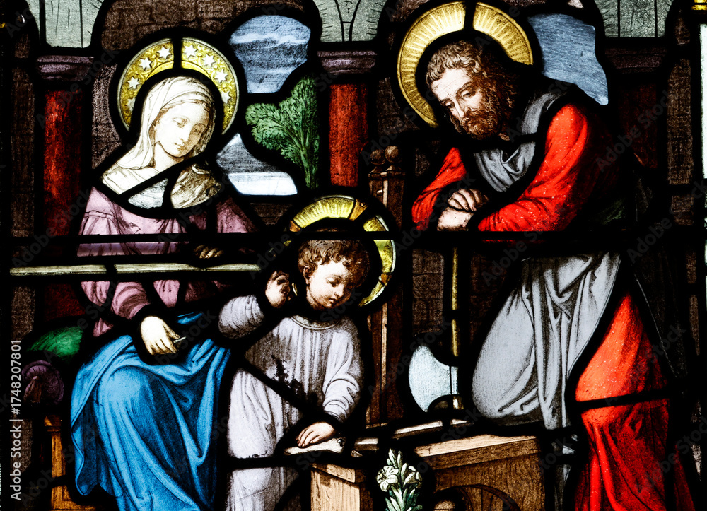 Fototapeta premium Church of the Cordeliers. Stained glass. Holy Family. Joseph the carpenter. Lons le Saunier. France.