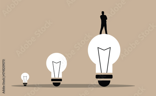 Silhouette of a Business Man on Big Light Bulb. White collar workers and company leader CEO looking for solution