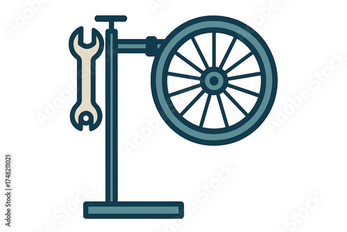 Bicycle wheel mounted on a repair stand with a hanging wrench ready for maintenance service
