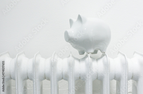 Piggy bank on a radiator, r...