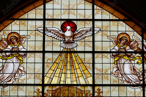 Stained glass. The dove of Holy Spirit.  Church of Fatima.  Ho Chi Minh city. Vietnam.