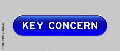 Blue color capsule shape button with word key concern on gray background