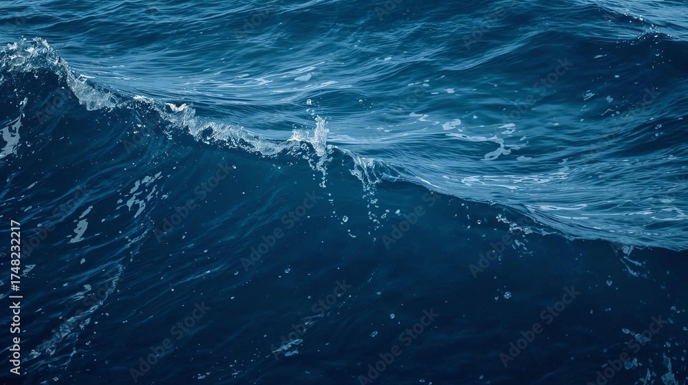 Obraz premium Deep blue ocean water with gentle waves and light reflections
