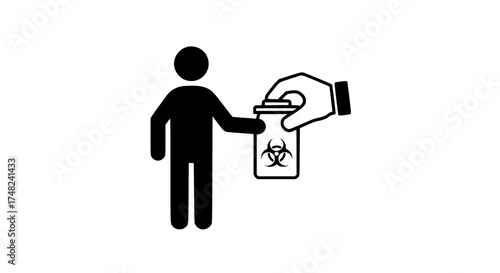 Hand holding radioactive container
