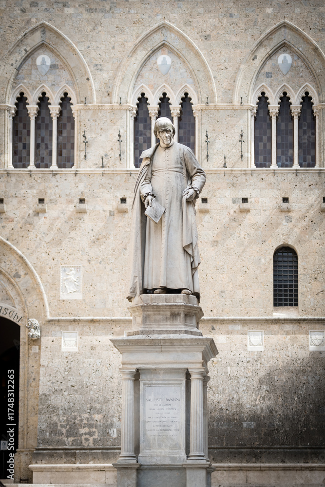 Obraz premium Statue of Sallustio Bandini at Piazza Salimbeni - the Main Office of Monte dei Paschi Bank in Siena, Italy