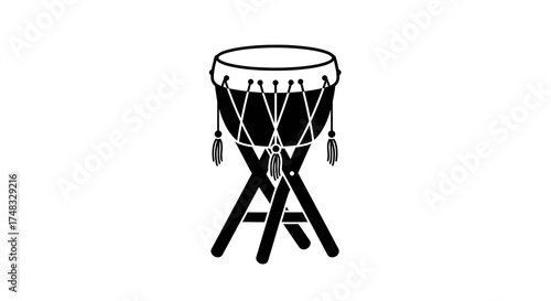 Silhouette of traditional drum on stand in minimalist black and white design