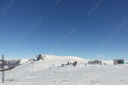 winter landscapes of the old mountain. stara planina ski center in winter, the surroundings of babin zub and the jabucko ravniste, ski slopes with skiers