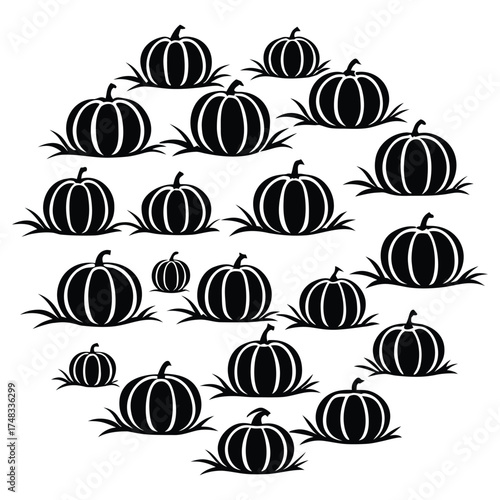 A black silhouette of a pumpkin patch scene