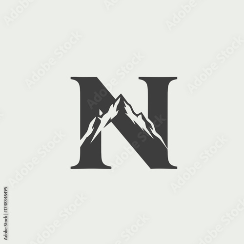 Minimalist Vector Illustration of Mountain Peaks Integrated into a Dark Gray Letter N Monogram Logo Design