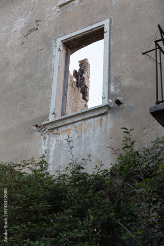 Overgrown Abandoned Villa with Broken Shutters and Balcony