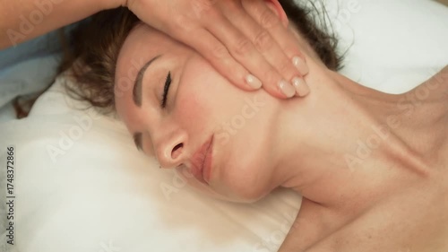 Wallpaper Mural Cosmetologist doctor is making myoplastic anti aging facial massage. Healthy lifestyle and body care concept. Relaxing woman lying on spa bed for facial and head massage. Treatment by facial massage Torontodigital.ca