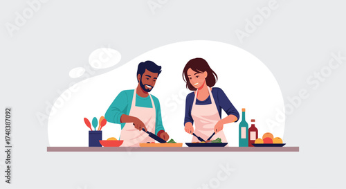 A couple is happily cooking a healthy meal together at home.