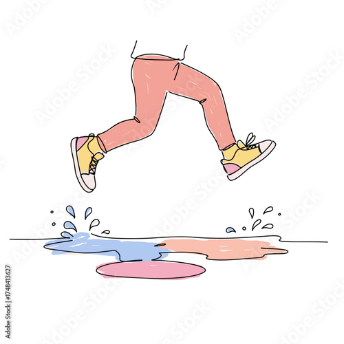 A child jumps over a puddle in multi-colored sneakers 