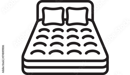 Comfortable double bed with two pillows, ready for restful sleep.