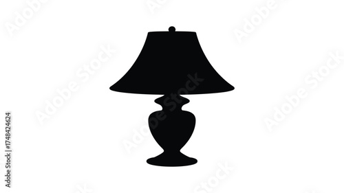 Classic silhouette of a table lamp with a bell shaped shade and ornate base