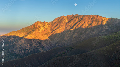 Moonrise over Mt Diablo North Peak at Sundown via Eagle Peak. Mt Diablo State Park, Contra Costa County, California, USA.