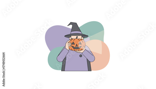 Person in witch hat holding jackolantern celebrating Halloween festivities
