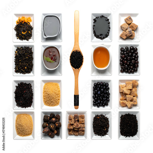 A grid arrangement of tea ingredients and tools in small white square dishes