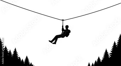 Silhouette of a person ziplining through the air enjoying outdoor adventure activities.
