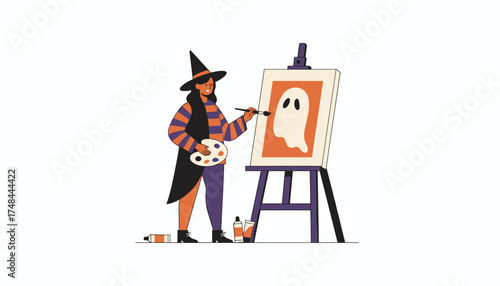Smiling witch paints a ghost on canvas celebrating Halloween with creative leisure
