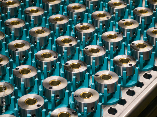 Precision machined metal components displayed on workbench in a manufacturing facility