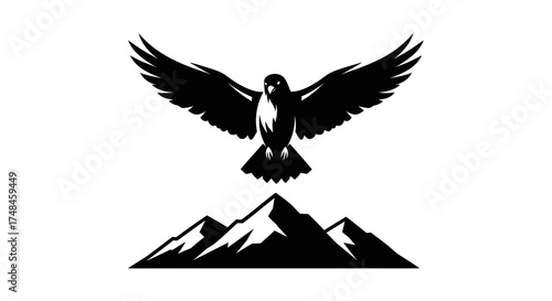 A bold black silhouette of a majestic eagle with spread wings flying over a mountain range.
