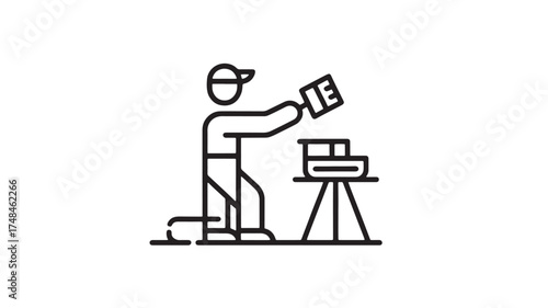 Skilled artisan meticulously crafting a detailed object with a paintbrush