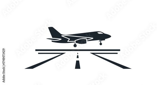 Silhouette of a jet airplane landing on a runway.