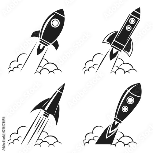 Four black rocket launch silhouettes with smoke trails