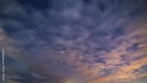 Starry night sky timelapse with glowing stars, moving clouds, cosmic atmosphere, and tranquil nature background.