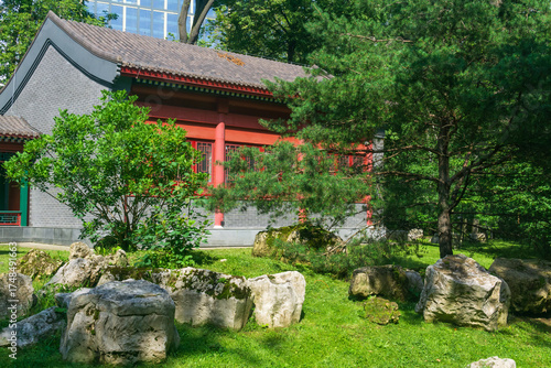 traditional Chinese architecture on a background of modern city buildings