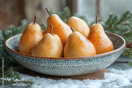 Pears in a bowl on a table.