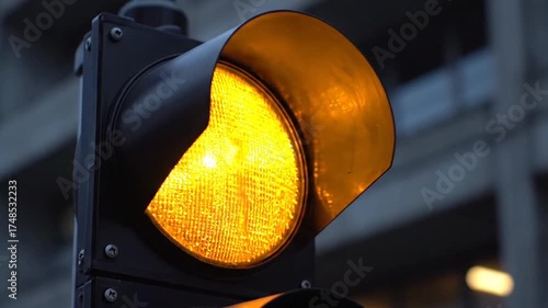 Close Up of Traffic Light with Red and Green Lights Against Blurry City Background