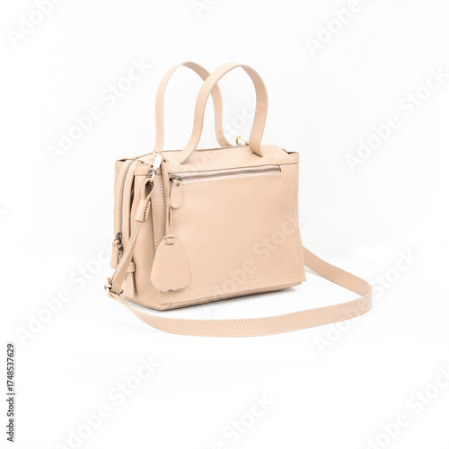 Beautiful leather bag for women in beige color open and empty isolated on white background