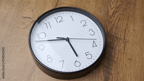 Wallpaper Mural A beautifully minimalist wall clock that showcases clear time markings set against a warm wooden background Torontodigital.ca