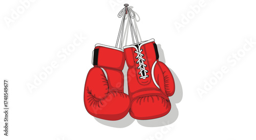 Pair of red boxing gloves hanging on a hook.