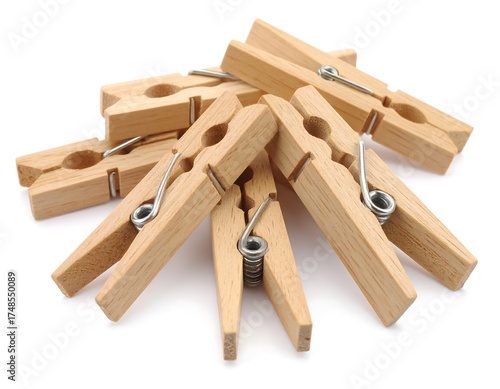 Wooden clothespins clustered together on a white background