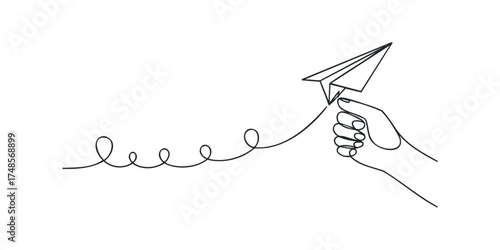 Hand launching paper airplane with trailing line