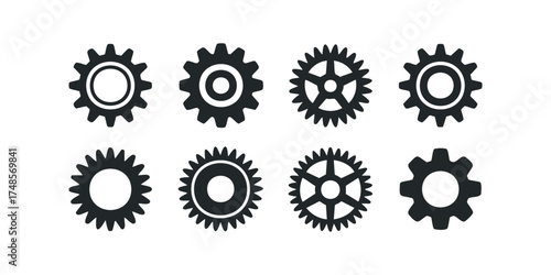 Collection of eight black gear icons with varied tooth counts