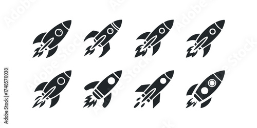 Collection of black rocket ship icons with exhaust flames