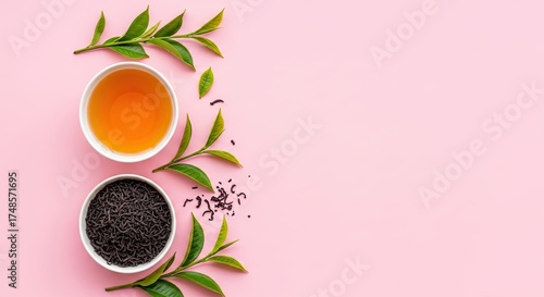 Herbal tea and dry tea leaves on a pink background