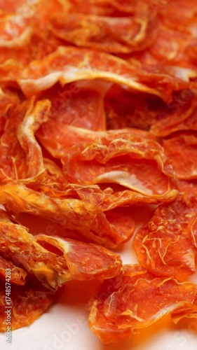 Wallpaper Mural Rotating freeze-dried mandarin slices. Close-up of dehydrated clementines in motion for healthy snacking, food preservation, or decoration Torontodigital.ca