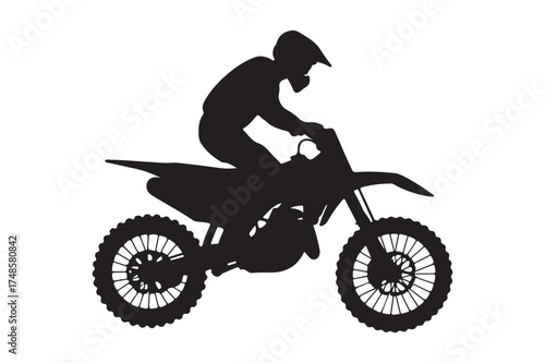 Silhouette of a motocross rider on a dirt bike