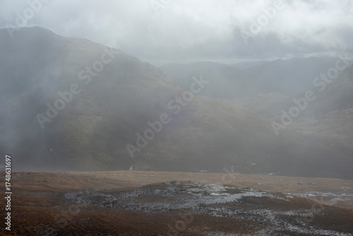Quadro em tela Misty foggy hills mountains in Scotland dramatic landscape hiking tourism active