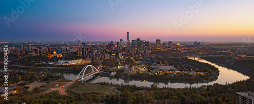 Panoramic aerial sunrise view of Edmonton skyline and Walterdale Bridge
