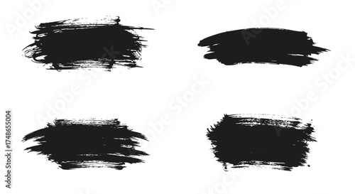 Four abstract black brush strokes on a clean white background display