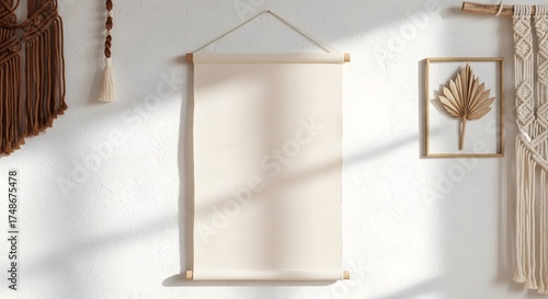 Close up shot of beige canvas hanging scroll with macrame wall hangings on white textured wall. Boho design element, room decoration, home decor and backdrop.